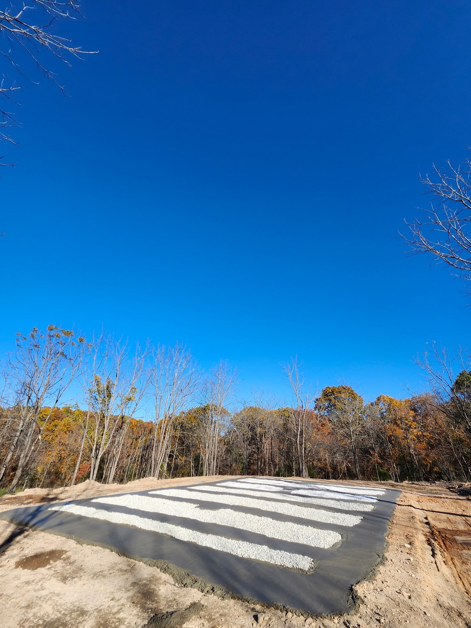 Mobile home pad preparation Springfield MO - concrete runners and gravel base for trailer park