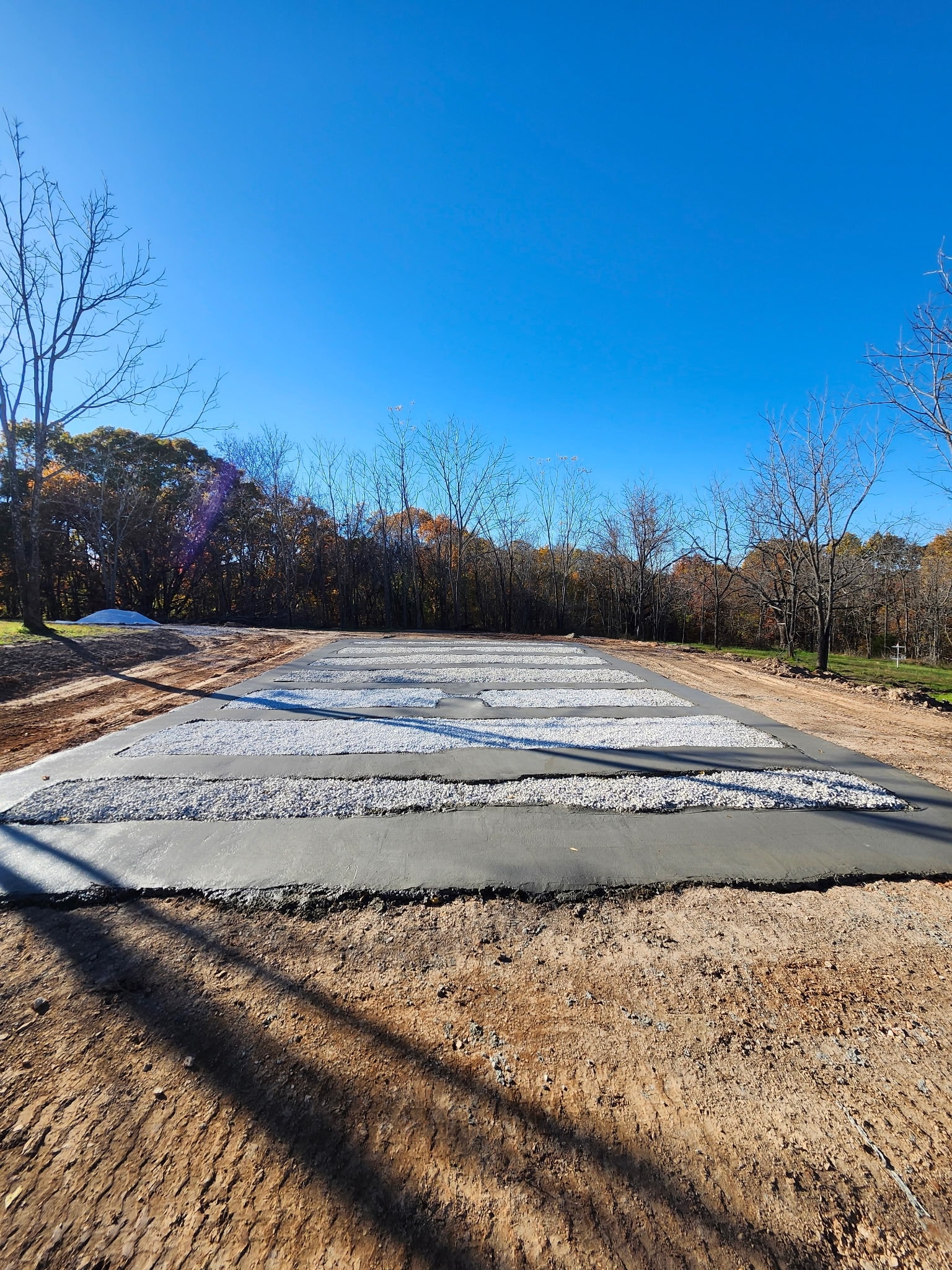 New trailer park pad construction Marshfield MO - concrete runners gravel base mobile home RV placement